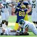 Michigan junior defensive end Craig Roh celebrates a tackle during the third quarter against Eastern Michigan at Michigan Stadium on Saturday. Melanie Maxwell I AnnArbor.com
